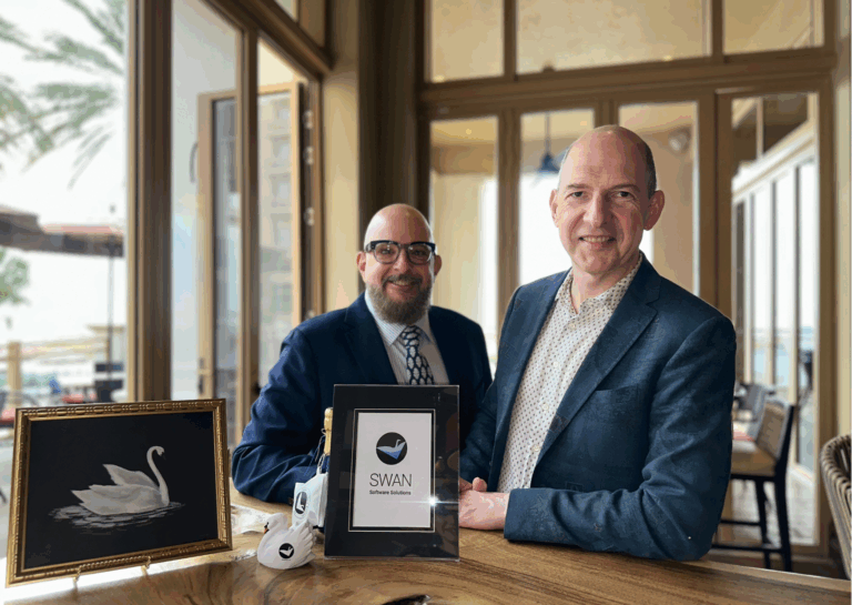 Felix and Paul sit at a table.