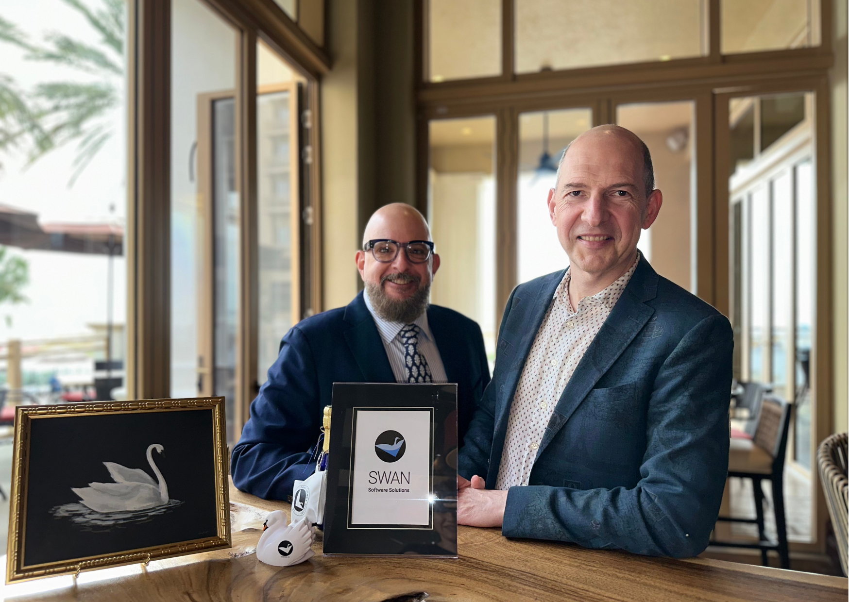 Felix and Paul sit at a table.